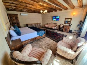 TV a/nebo společenská místnost v ubytování Cappadocia Caves Hotel