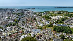 an aerial view of a city with the ocean at THE INN Hotel Bar and Restaurant in Saint Helier Jersey
