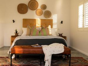 a bedroom with a large bed with a wooden headboard at Stanford View in Stanford