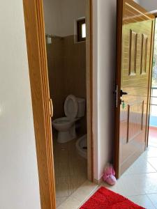 an open door to a bathroom with a toilet at Lirim Shenmiter Lukove in Lukovë