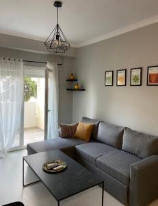 a living room with a couch and a table at 415 Guest House in Xanthi