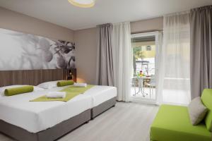 Posteľ alebo postele v izbe v ubytovaní Residence Garden Istra Plava Laguna + 37 fotografií