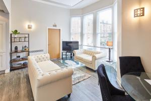 a living room with a couch and a table at Host & Stay - Three Bays in Scarborough