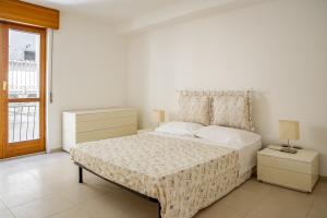 Postel nebo postele na pokoji v ubytování A due passi da Cala Rossa in Ortigia by Wonderful Italy