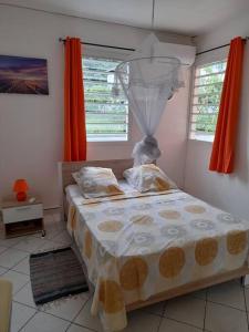 Ein Bett oder Betten in einem Zimmer der Unterkunft MAISON DE VACANCES PERDRIX