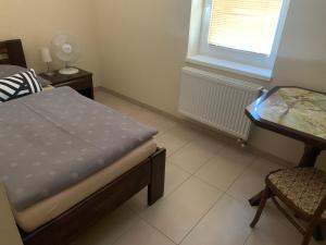 A bed or beds in a room at Reštaurácia-penzión ALTANA