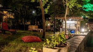 a garden at night with a tent in the grass at Fener Motel in Şile