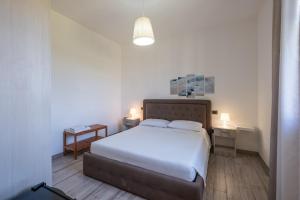 En eller flere senge i et værelse på Perla Salentina + 23 billeder