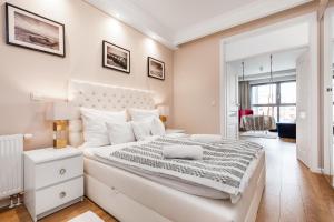 Ένα ή περισσότερα κρεβάτια σε δωμάτιο στο Uroczy Apartament No1 w ,, SERCU Starego Miasta Wyspa Spichrzów,,