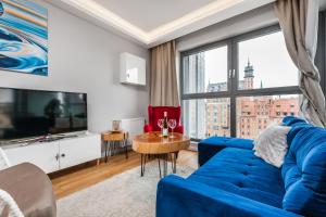 Telewizja i/lub zestaw kina domowego w obiekcie Uroczy Apartament No1 w ,, SERCU Starego Miasta Wyspa Spichrzów,,