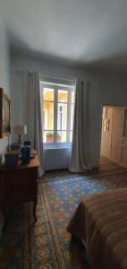 Łóżko lub łóżka w pokoju w obiekcie Jolie maison de ville La Petite Magnanerie