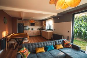 a living room with a couch and a kitchen at Blacksea Dream House in Trabzon