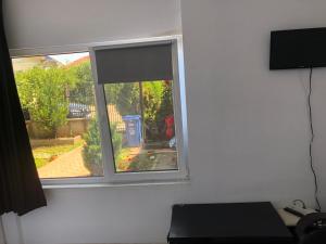 TV a/nebo společenská místnost v ubytování Casa Vio parter