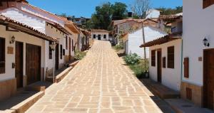 an empty street in a village with buildings at Unique House Elena Barichara Open Space Bright in Barichara