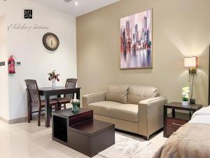 Posezení v ubytování Mira Holiday Homes - Furnished studio in Downtown