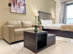 Posezení v ubytování Mira Holiday Homes - Furnished studio in Downtown