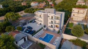 an aerial view of a house with a swimming pool at Apartments Posejdon Lux in Utjeha