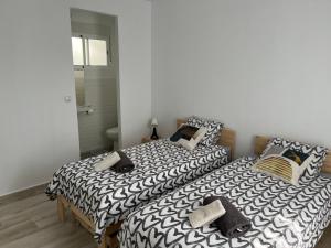 Posteľ alebo postele v izbe v ubytovaní Alzira bonita Apartamento D junto a Plaza Mayor, Santa Catalina