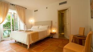 Postel nebo postele na pokoji v ubytování Hotel Can Verdera