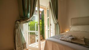 Postel nebo postele na pokoji v ubytování Hotel Can Verdera