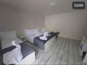 Postel nebo postele na pokoji v ubytování AmA