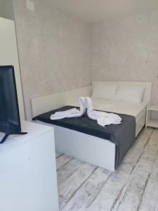 Postel nebo postele na pokoji v ubytování AmA