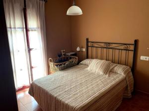 Łóżko lub łóżka w pokoju w obiekcie Casa situada en un entorno natural Casa Rural La Serena