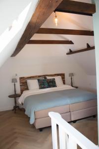 Postel nebo postele na pokoji v ubytování B&B de Olde Hilde