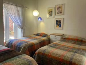 En eller flere senge i et værelse på ARCOS DE LA LOMA