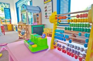 a room with a table with a toy abacus at My resort by Sea room in Hua Hin