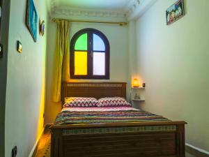 A bed or beds in a room at Tangier Kasbah Hostel