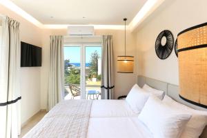 A bed or beds in a room at Villa Constantino with heated pool