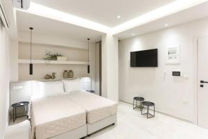 A bed or beds in a room at Villa Constantino with heated pool