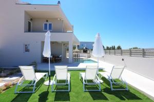 A patio or other outdoor area at Villa Constantino with heated pool