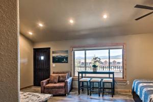 a room with a table and chairs and a window at Dreamy Angel Fire Studio Less Than 2 Mi to Ski Resort! in Angel Fire