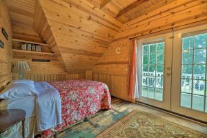 a bedroom with a bed in a wooden room at Coastal Grand - Walk to Lake Michigan! in Ludington