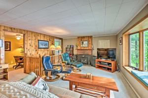 a living room with a couch and chairs at Le Roy Lakefront Retreat with Dock and Kayaks! in Le Roy