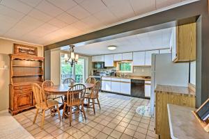 a kitchen and dining room with a table and chairs at Le Roy Lakefront Retreat with Dock and Kayaks! in Le Roy