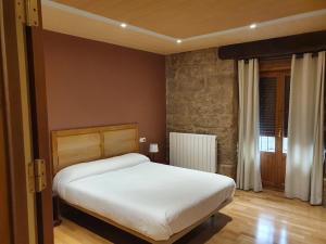 Posteľ alebo postele v izbe v ubytovaní Hostal Rural 18 de Abril