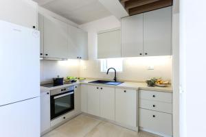 A kitchen or kitchenette at Villa Constantino with heated pool