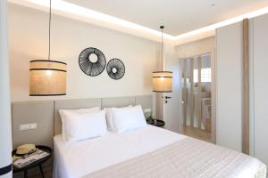 A bed or beds in a room at Villa Constantino with heated pool