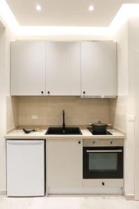 A kitchen or kitchenette at Villa Constantino with heated pool