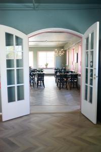 a room with a dining room with tables and chairs at B&B Korsman Hanko in Hanko