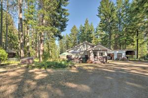 a house in the middle of a forest at Cozy Klamath Falls Home Near Fishing and Parks! in Klamath Falls