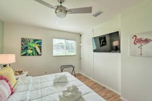a bedroom with a bed and a ceiling fan at Punta Gorda Retreat Near Historic Downtown! in Punta Gorda