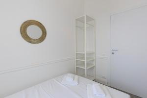 A bed or beds in a room at Appartamento Cloe
