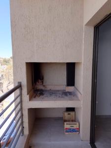 a fireplace in the side of a building at S4 Hermoso departamento para conocer Mendoza in Godoy Cruz