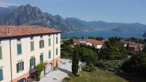 a view of a town with a lake and mountains at Residenza Ca' laRipa in Solto Collina