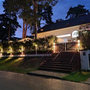 a building with stairs and lights on it at Guest House KAKTUS in Riga