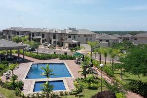 an aerial view of a apartment complex with a swimming pool at Ecuabook Via a la Costa Gye Puerto Azul in Guayaquil